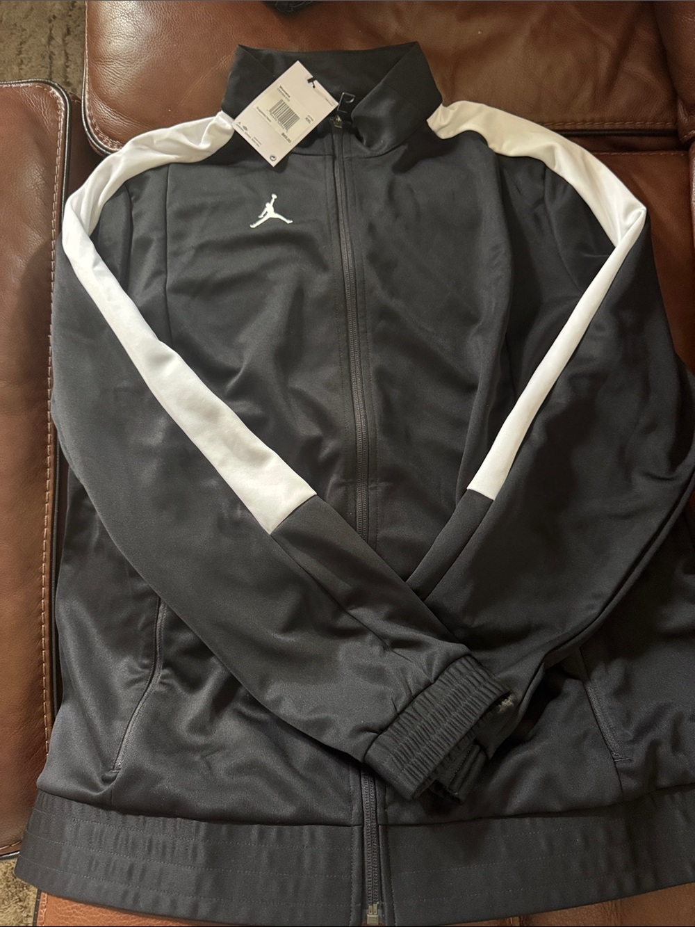 Nike Jordan woman’s Black Track Jacket with White Stripe